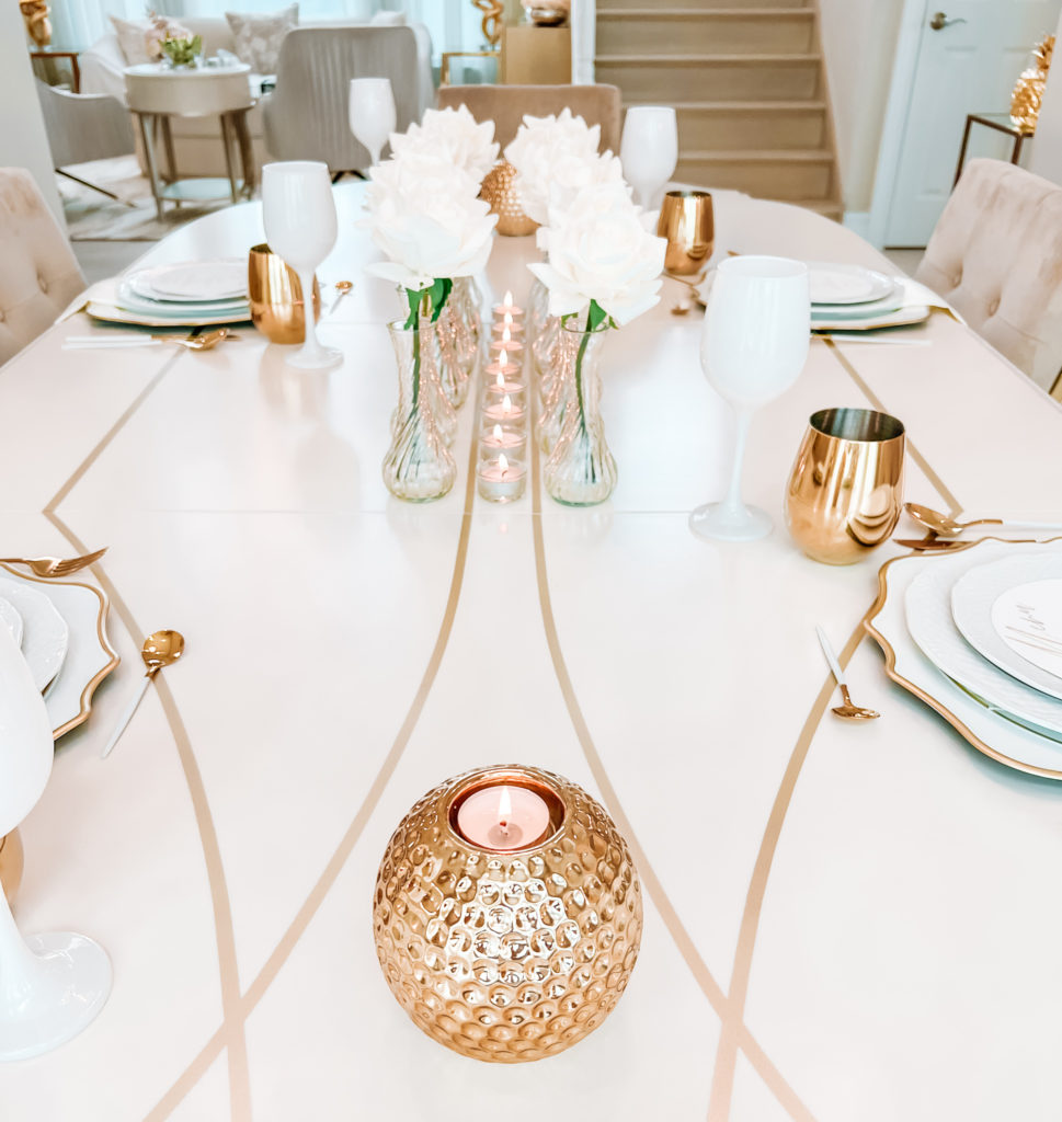 A FORMAL TABLE WITH WHITE DECOR 