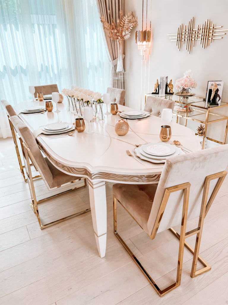 A FORMAL TABLE WITH WHITE DECOR 