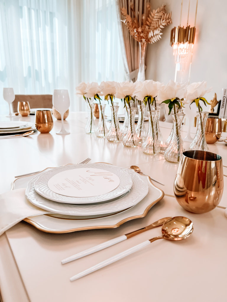 A FORMAL TABLE WITH WHITE DECOR 