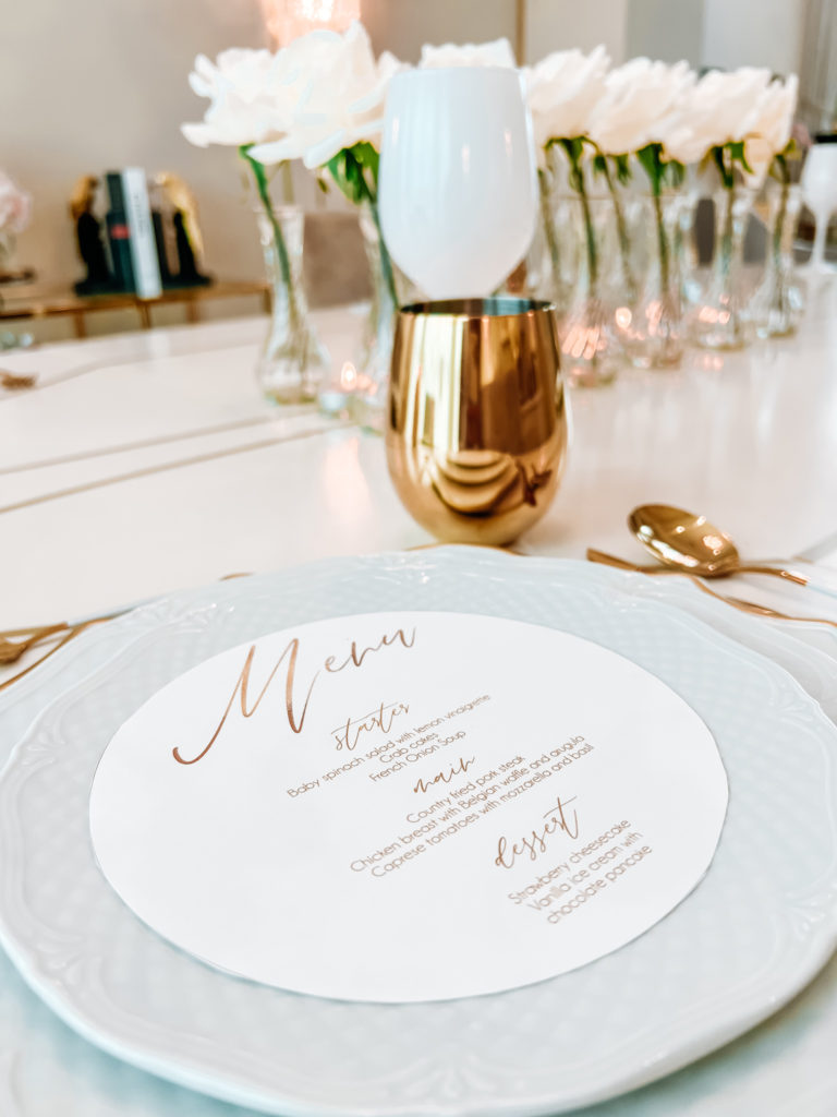 A FORMAL TABLE WITH WHITE DECOR 
