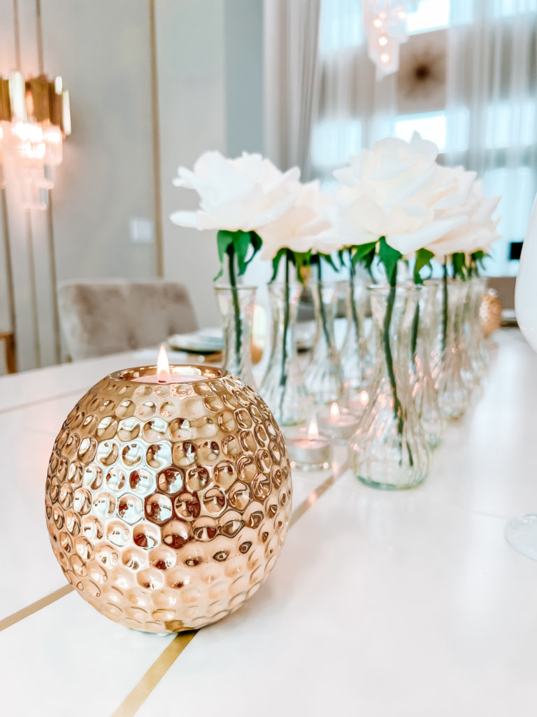 A FORMAL TABLE WITH WHITE DECOR 
