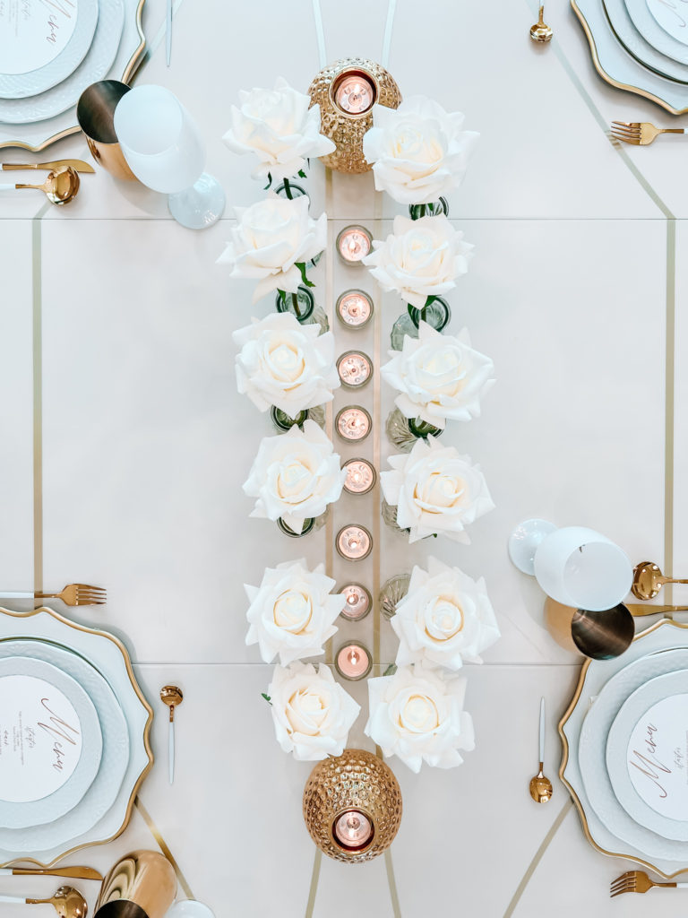 A FORMAL TABLE WITH WHITE DECOR 