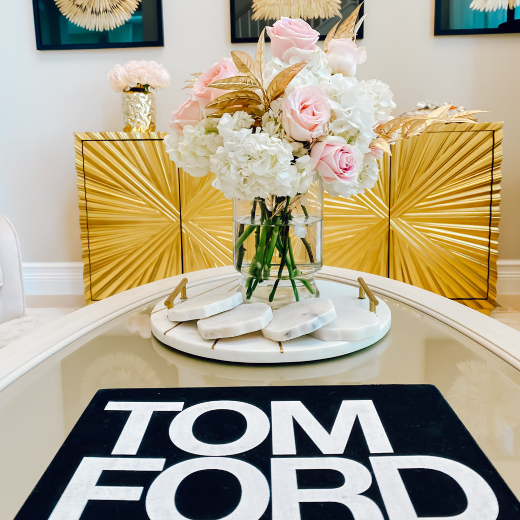 A ROSE FLOWER ARRANGEMENT WITH A TOUCH OF GOLD