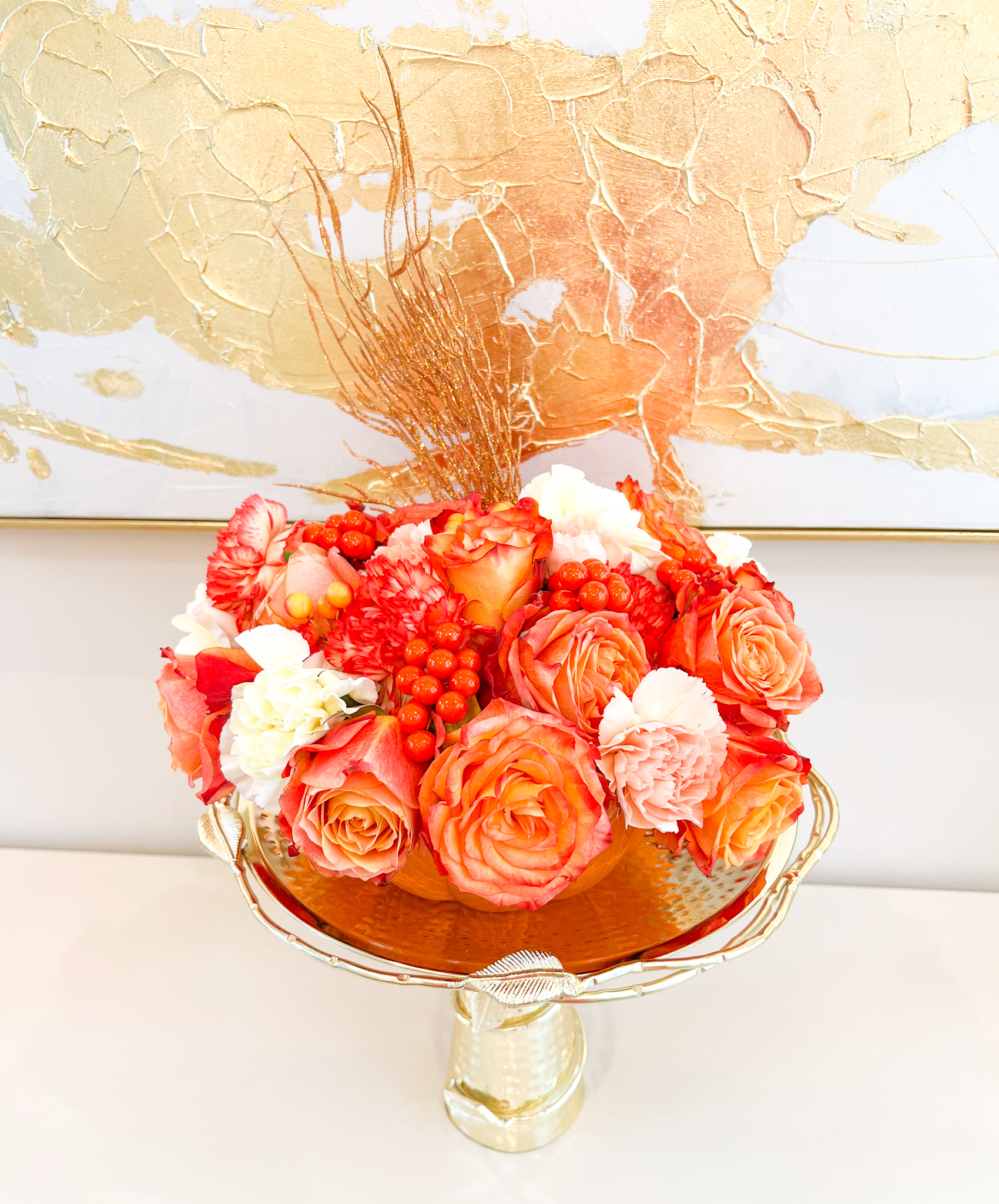 ￼FALL FLOWERS AND A PUMPKIN VESSEL MAKE A BEAUTIFUL ARRANGEMENT