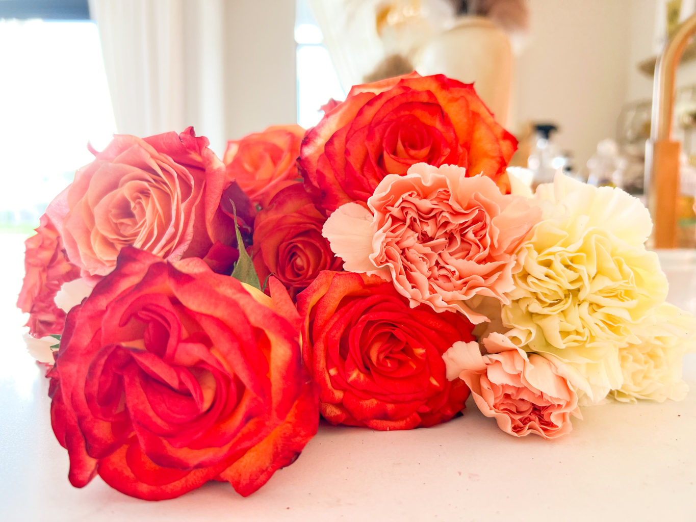 fall flowers in a pumpkin vase